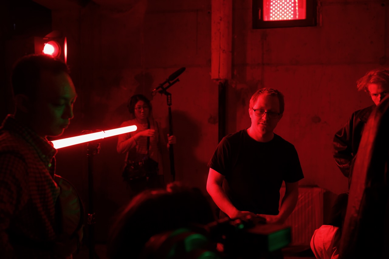 Crew and a red tube light on the concrete set.